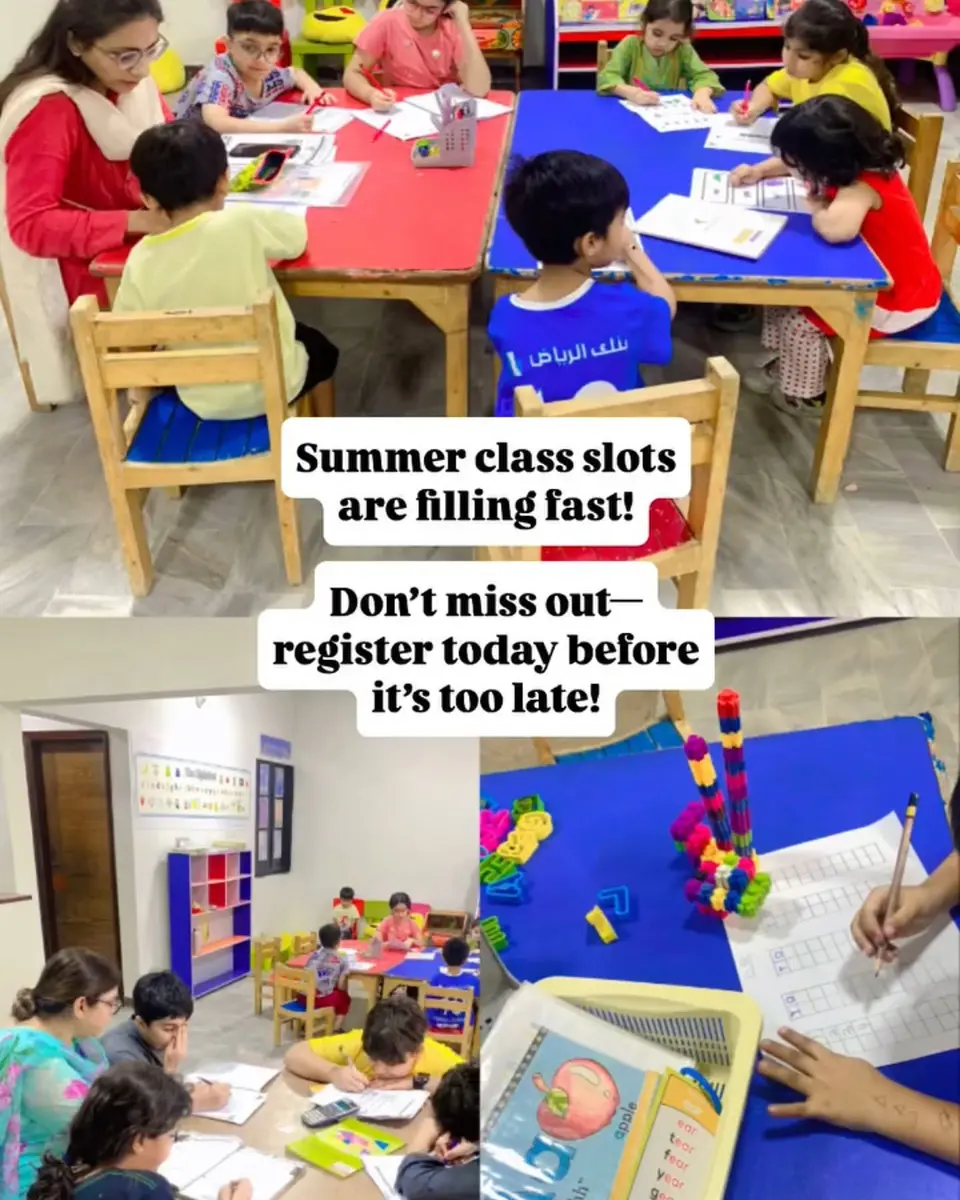 Children working at desks in small groups at After School Academy, Karachi